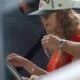 Taylor Swift Front with Kansas City Wears, Cap and TNT Bracelet in Melbourne In Nod to Travis kelce 