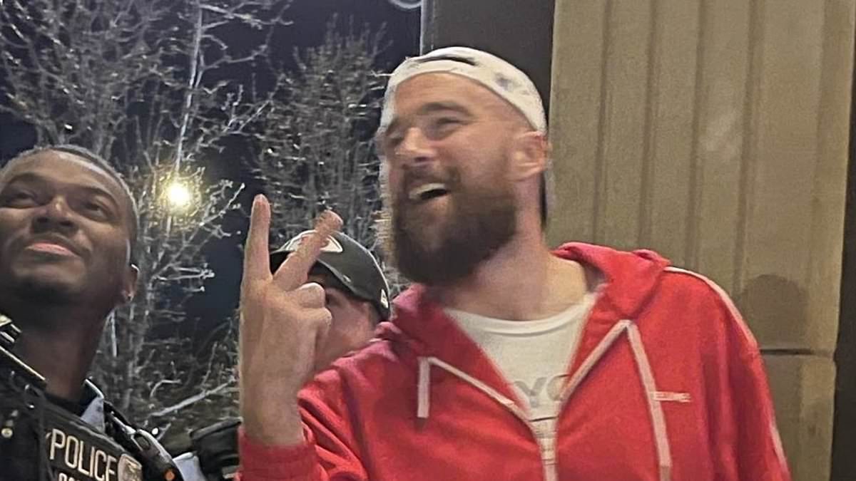 A THIRD red flag for Taylor! Fans slam 'tone deaf' Travis Kelce for posing for smiling selfie with KC cop in the wake of deadly shooting... after previously shoving his coach at Super Bowl and appearing too drunk to talk at parade