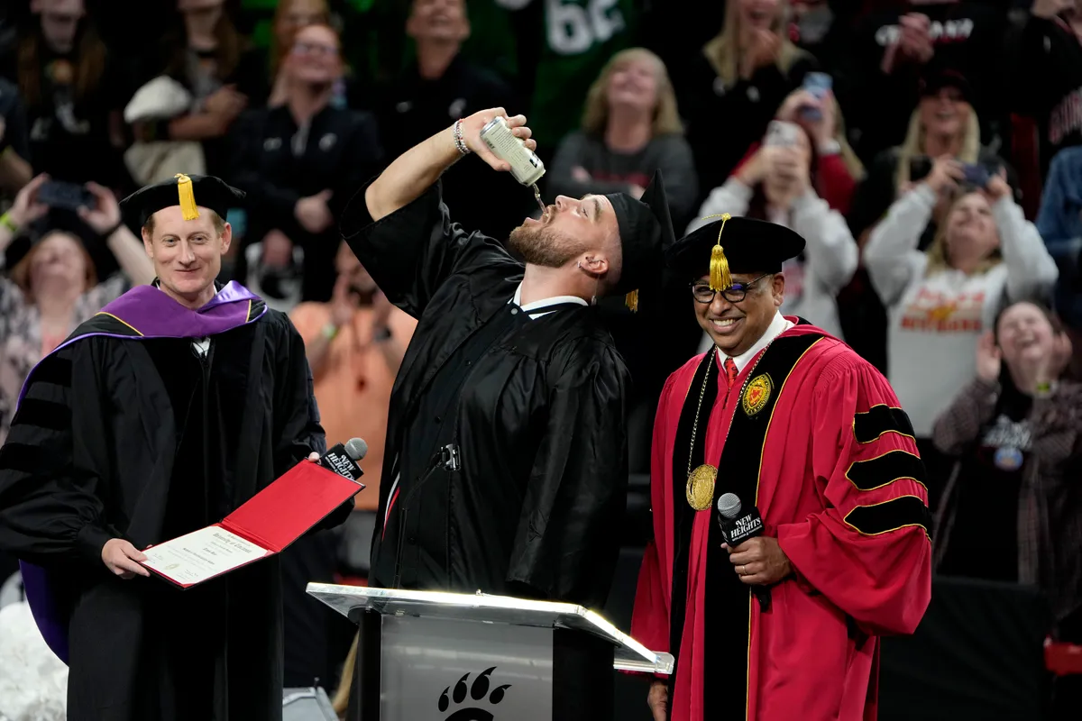 Controversy: Kansas City Chiefs TE Travis kelce Blasted and Slammed for chugging a beer at a fake commencement ceremony...Tagging him 'attention seeker' and 'immature'