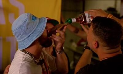 Travis Kelce downs a whiskey shot from a slice of BREAD and sings on stage with Patrick Mahomes as he lets loose at his music festival after leaving girlfriend Taylor Swift in Europe