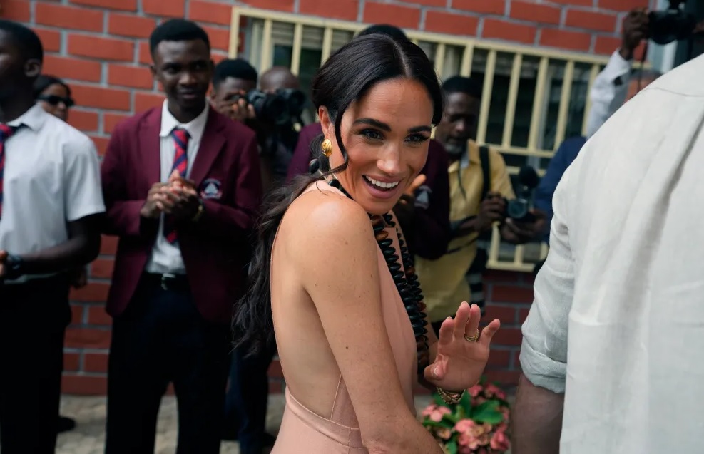 Meghan Markle Slammed and roasted over her choice of dress during the visit to nigeria...."Shameless, how could she put on a sleeveless and backless silk gown revealing her body like that"