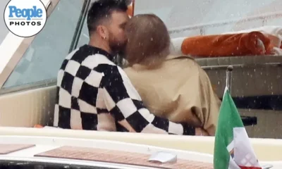Taylor Swift and Travis Kelce are pictured kissing and embracing on boat ride in scenic Lake Como during romantic break – as singer wows in busty black dress ahead of The Eras Tour return
