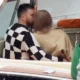 Taylor Swift and Travis Kelce are pictured kissing and embracing on boat ride in scenic Lake Como during romantic break – as singer wows in busty black dress ahead of The Eras Tour return