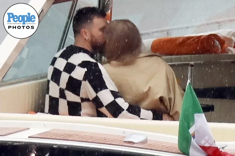 Taylor Swift and Travis Kelce are pictured kissing and embracing on boat ride in scenic Lake Como during romantic break – as singer wows in busty black dress ahead of The Eras Tour return