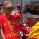 Adorable moment Travis Kelce and Patrick Mahomes make young cancer survivor's day... as superstar Chiefs pair pose for photos - and sign a shirt hailing 'Taylor Swift's boyfriend'