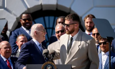 President Biden, aged 81, added a touch of humor by donning a Kansas City Chiefs helmet. As he put on the helmet, he playfully joked about potentially banning NFL star Travis Kelce from using the microphone, as a reporter shouts, "Where's Taylor Swift?"
