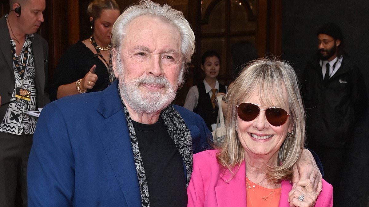 Twiggy, 74, looks sensational in a hot pink suit as she cosies up to her husband Leigh Lawson at Hello, Dolly! press night