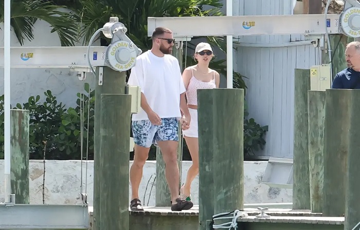 Continues love story with Taylor Swift by making declaration: Travis Kelce’s hand placement is its own romance trope and I will die on this hill, claiming he’s the “happiest I’ve ever been” after a big 12 months.