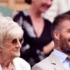 David Beckham is besieged by fans as he leads the Centre Court stars for day one of Wimbledon - before joining Katherine Jenkins and her husband Andrew Levitas in the Royal Box following OBE drama