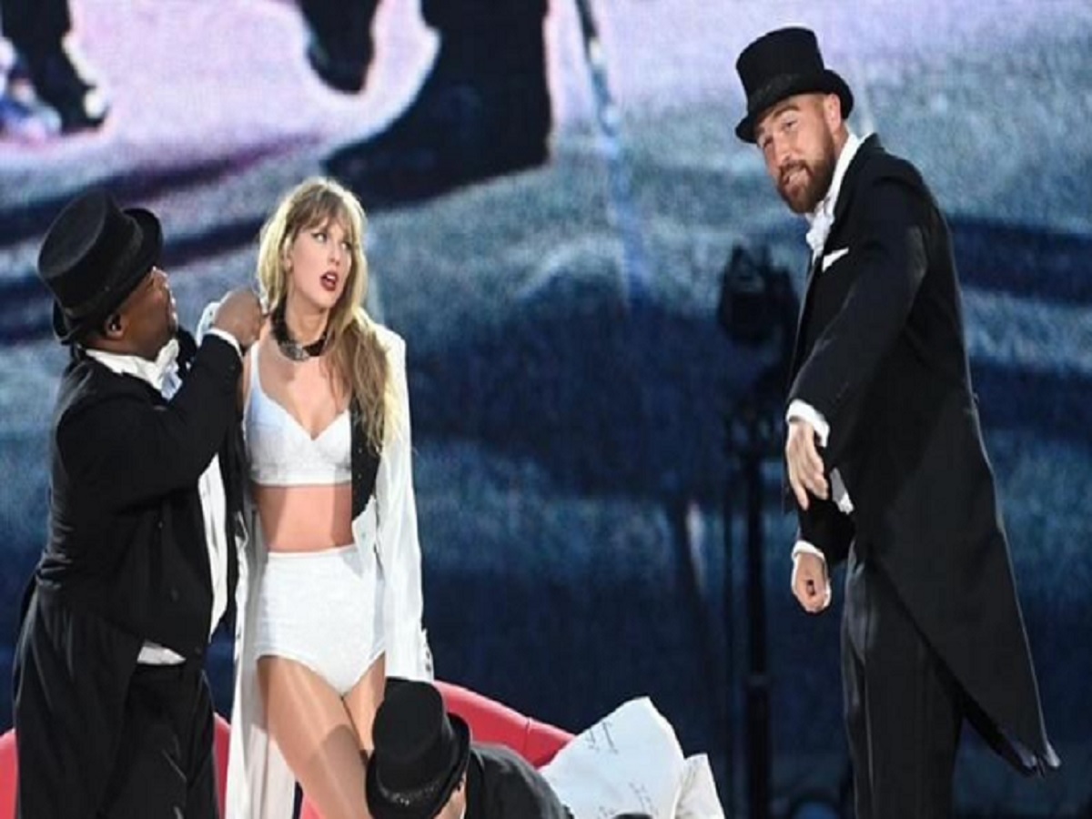 Once You See Travis Kelce Sweetly Walking Taylor Swift Off The Eras Tour Stage, it was like walking her down the aisle You’ll Understand Why Fans Can’t Get Enough Of This Viral Moment